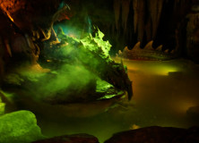 Disneyland Paris has a dragon under Sleeping Beauty's castle.