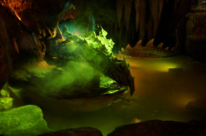 Disneyland Paris has a dragon under Sleeping Beauty's castle.